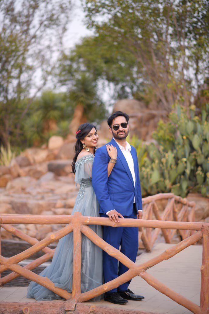 Couple posing outdoors for a pre-wedding portrait